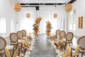 neutrally-decorated-aisle-in-bright-venue.jpeg